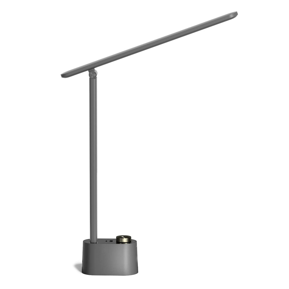 Honeywell HWT-H01 LED desk lamp on desk delivers near-natural light for focused work.
