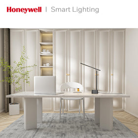 Honeywell Sunturalux LED Desk Lamp 180-degree head tilt for versatile positioning.