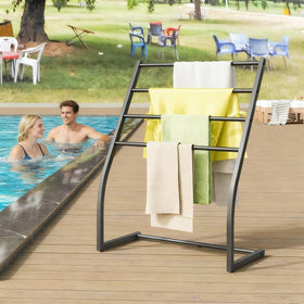Honiter rack holding towels and blankets for quick air-drying.