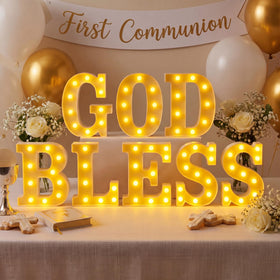 Honoson God Bless LED letter signs illuminate off-white for a respectful first communion display.