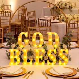 Honoson God Bless table display adds reverent ambiance to celebrations.