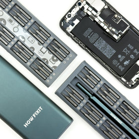 HowFixit PRO compact toolkit beside a laptop, ready for maintenance and upgrades.