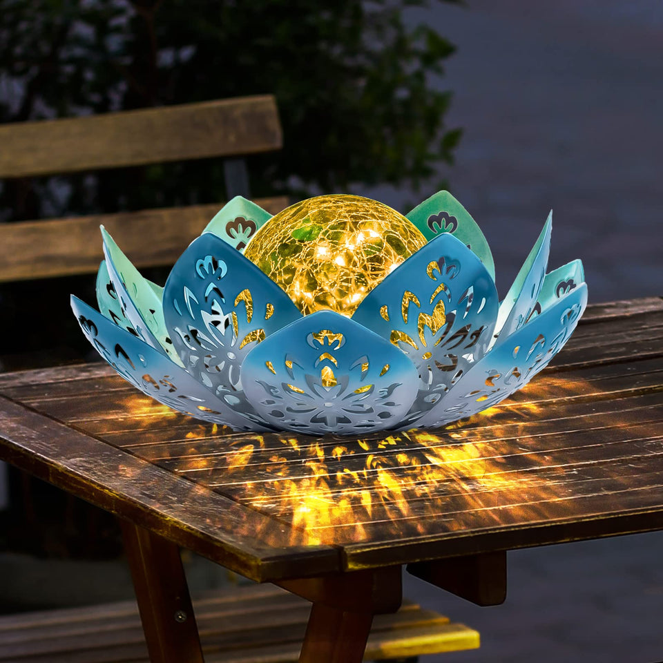Huaxu solar lotus globe lamp illuminates outdoor paths with a graceful blue glow.