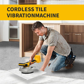 HUICCN tile vibration machine ergonomic handle and lock button in use.