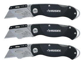 Husky folding knife with textured handle for secure grip in wet conditions.