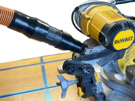 HuttonTOOLS hose adapter connects a 2-1/2-inch dust hose to a DeWalt miter saw for cleaner dust collection.