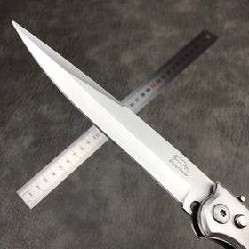 HUAAO push-button lock feature demonstrated for secure folding during carry.