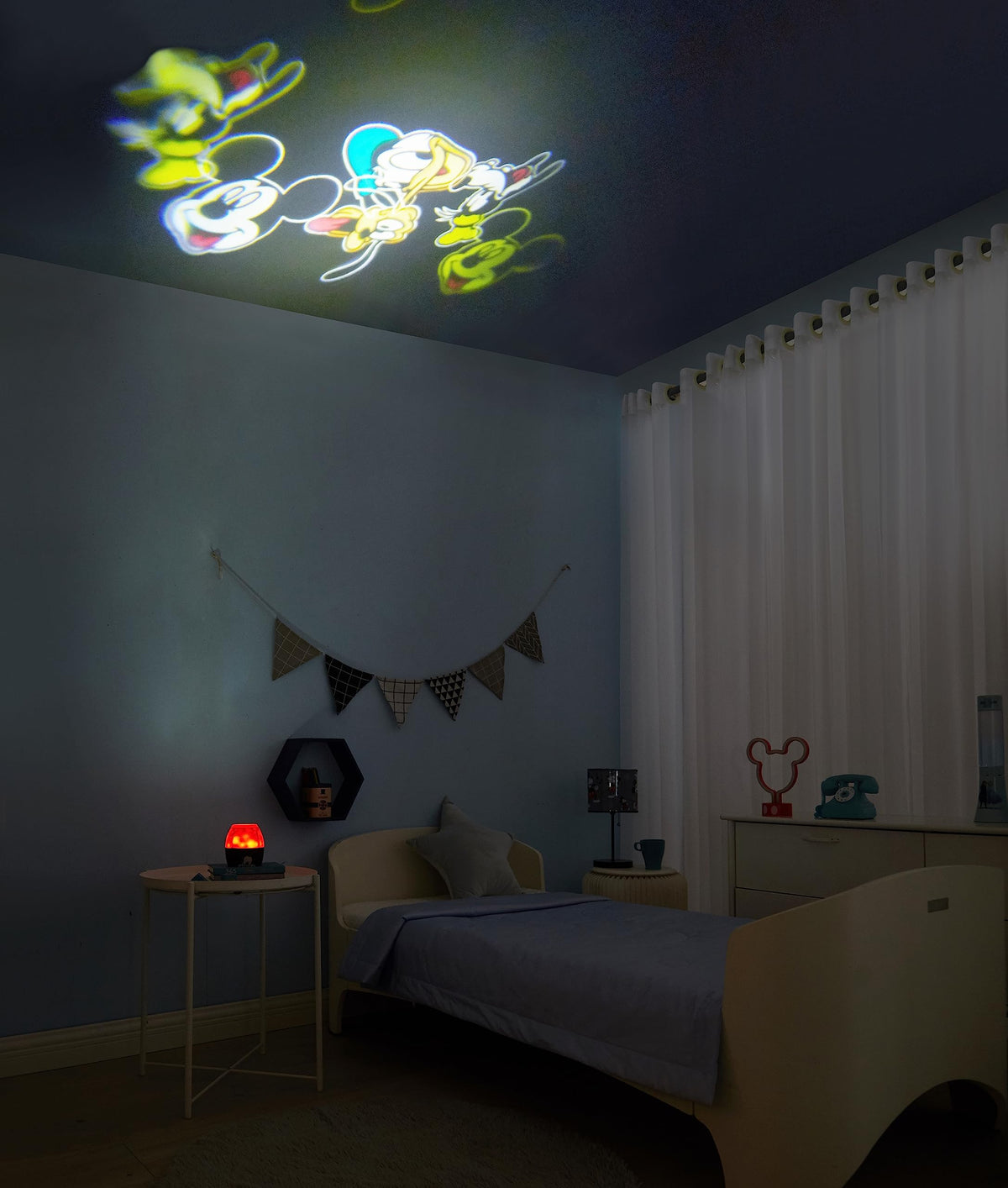 Idea Nuova battery-operated projection lamp offers portable decor for travel.