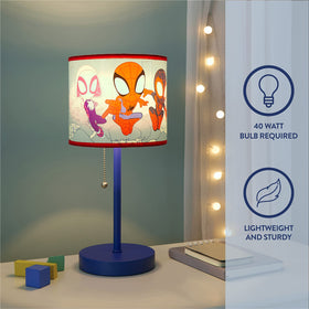 Idea Nuova Spidey table lamp illuminated on a desk for study time