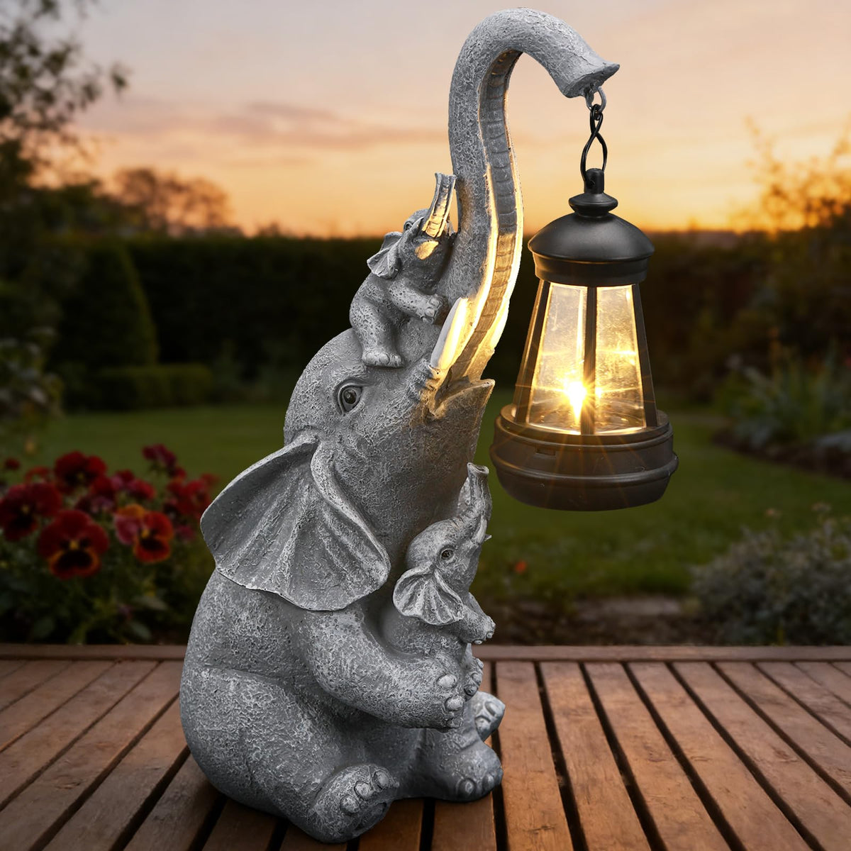 IDEA SHOW solar elephant lantern glows softly along garden path.
