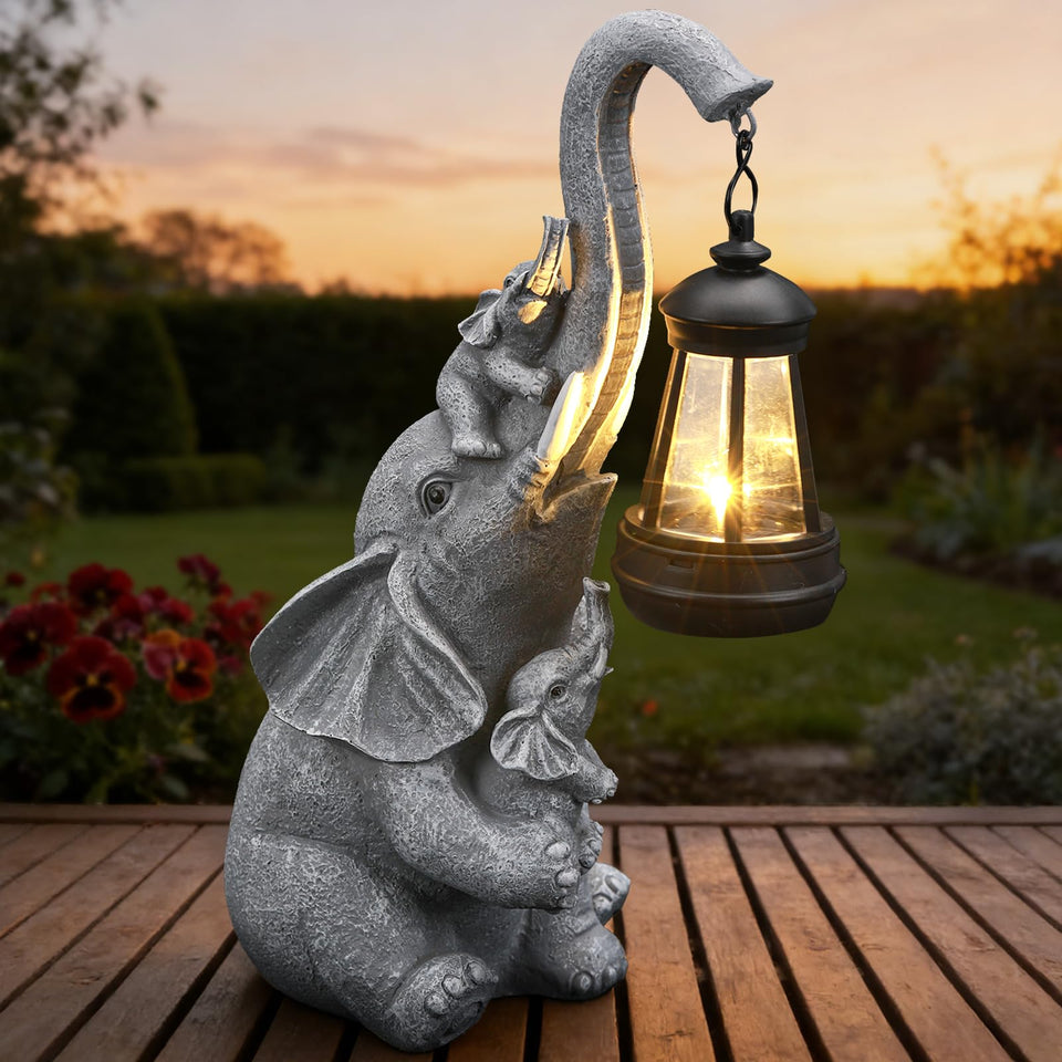 IDEA SHOW solar elephant lantern glows softly along garden path.