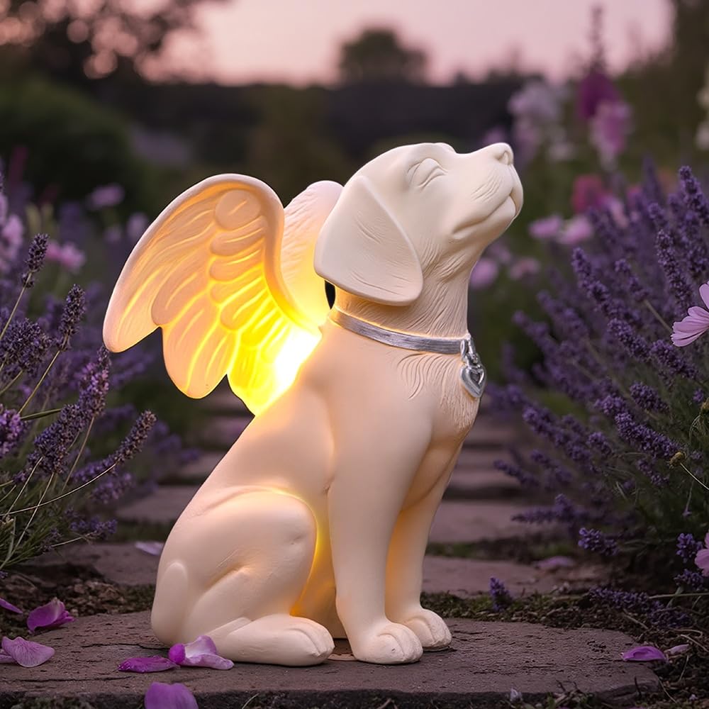 iHeartDogs dog memorial angel statue in garden with solar glow for evenings.