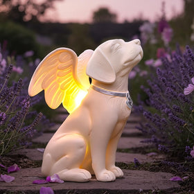 iHeartDogs dog memorial angel statue in garden with solar glow for evenings.