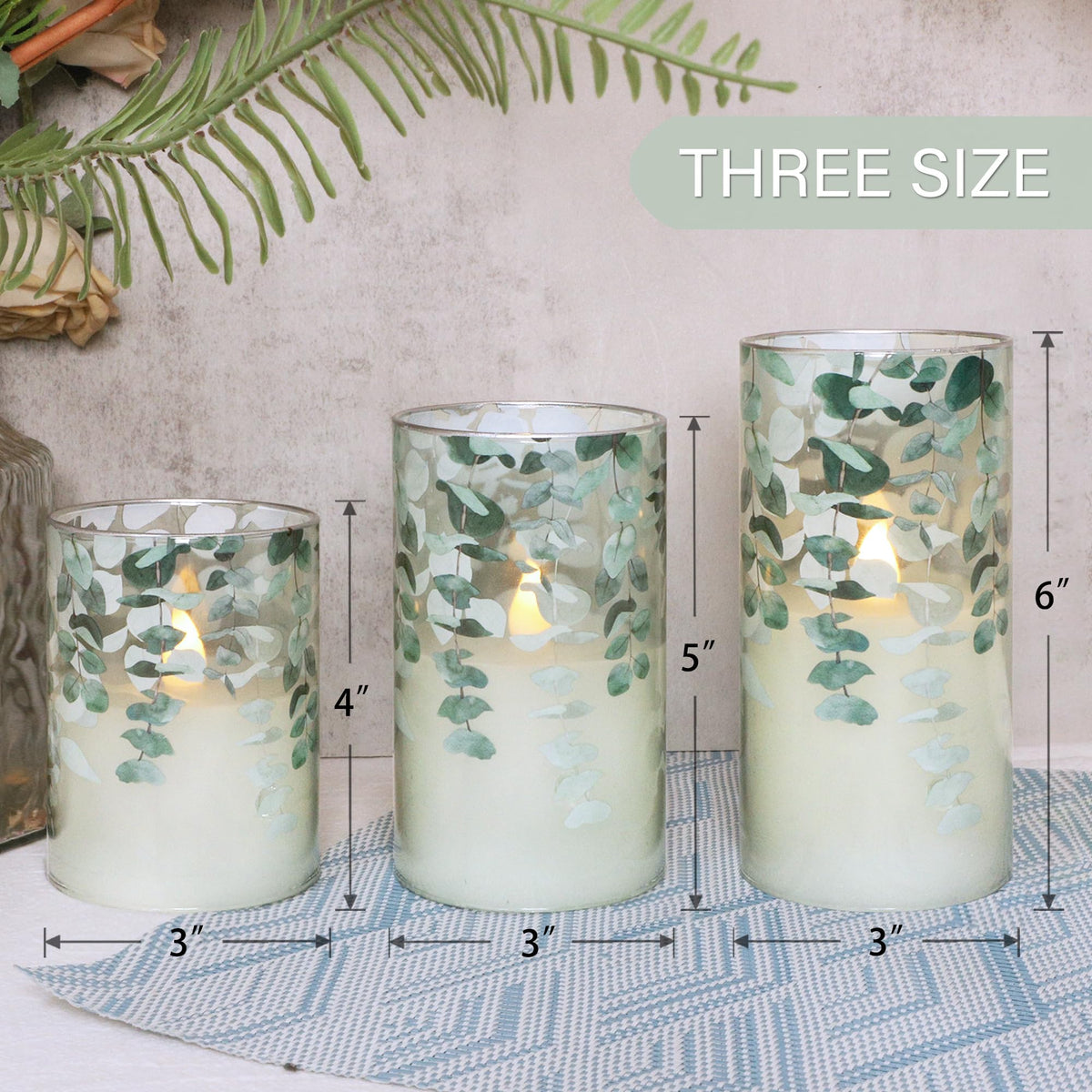 Immeiscent flameless candle with eucalyptus pattern adds natural table charm.