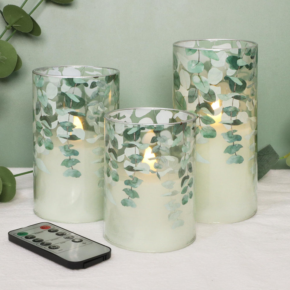 Immeiscent green glass flameless candle with remote timer provides safe ambient lighting.