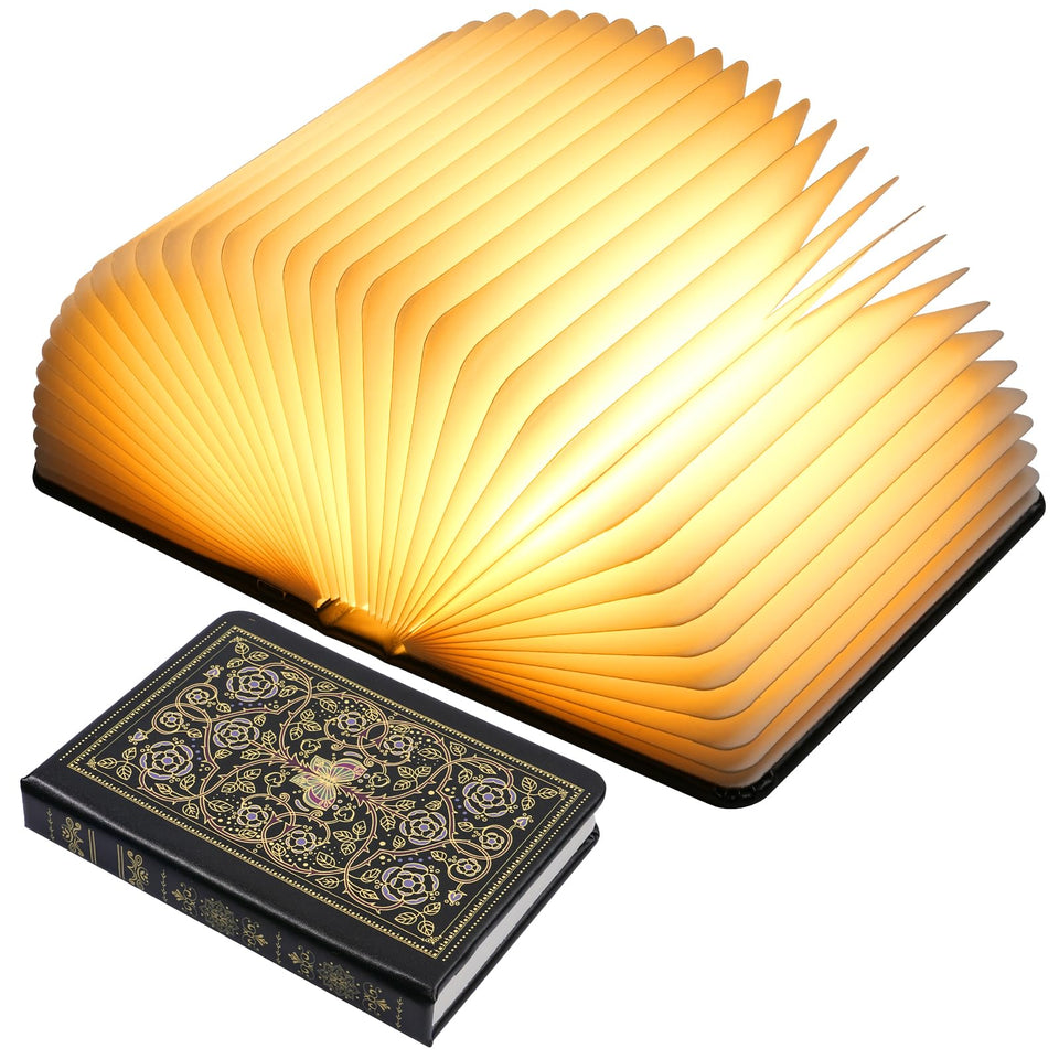 Incolumitas book lamp folded hardcover cover glows softly for cozy reading.