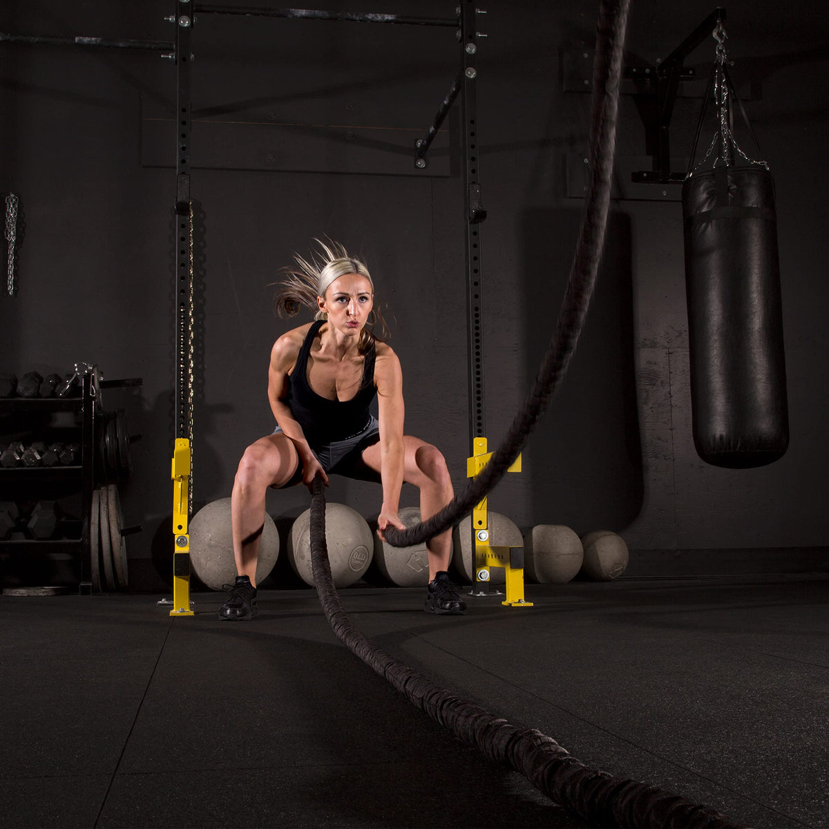 IncStores garage workspace mat roll laid under weights for moisture-resistant protection.