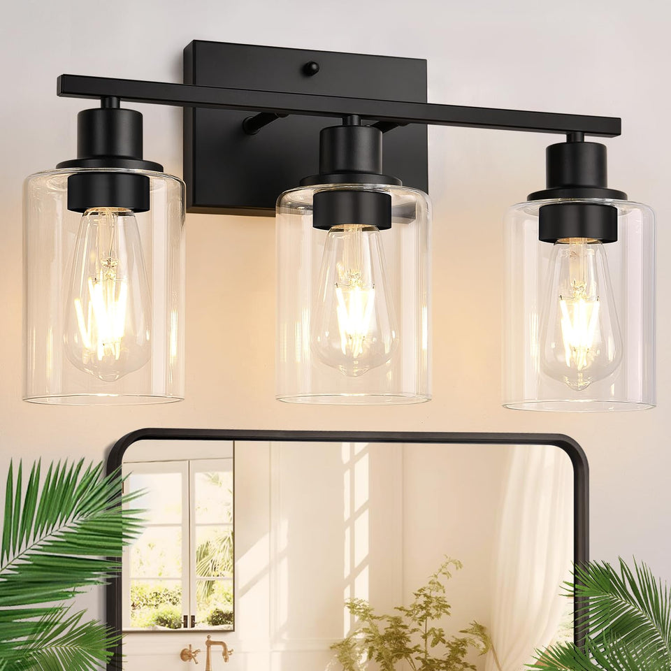 Indoi 3-light bathroom fixture with matte black finish and clear glass shades.