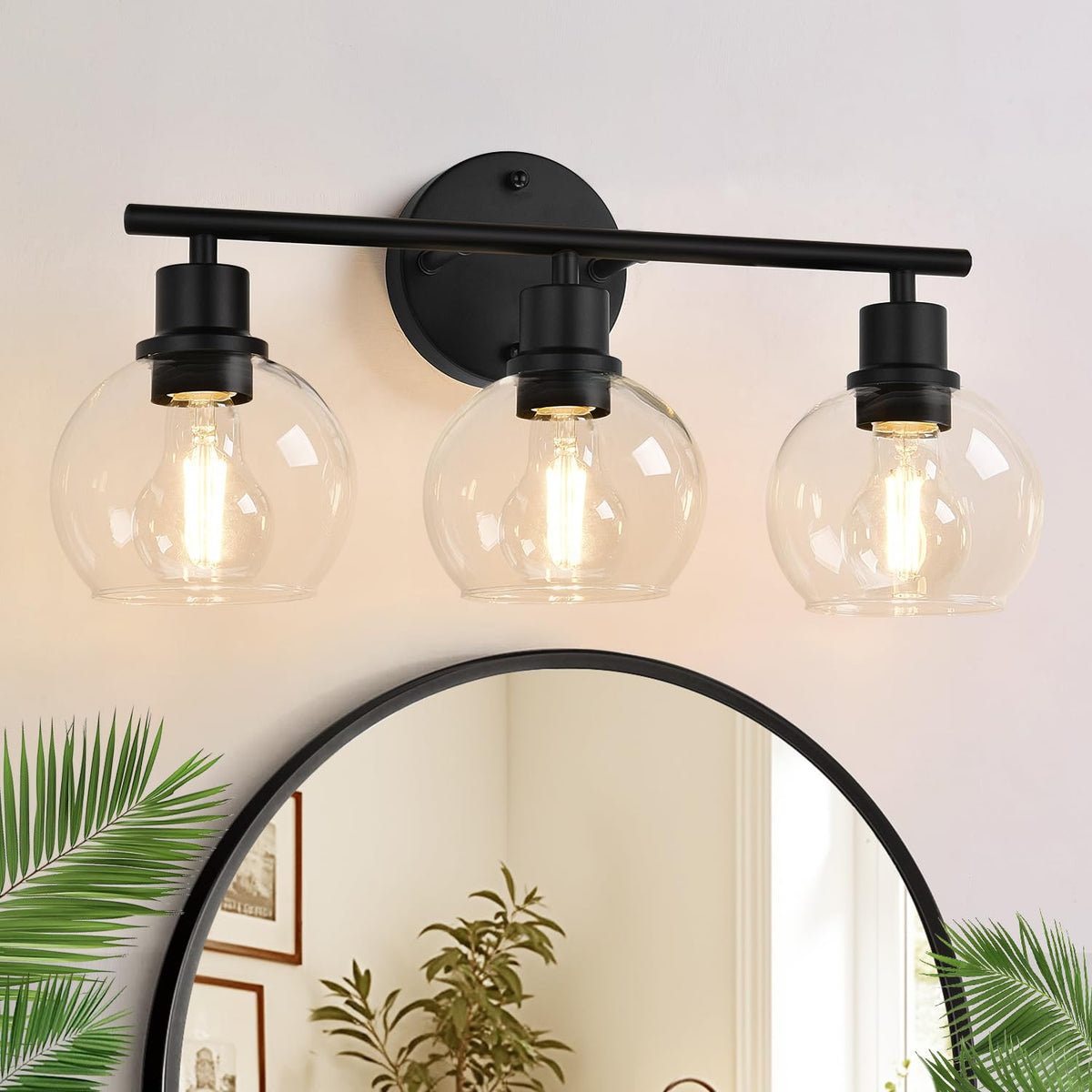 Indoi 3-light matte black fixture over mirror for bright vanity tasks.