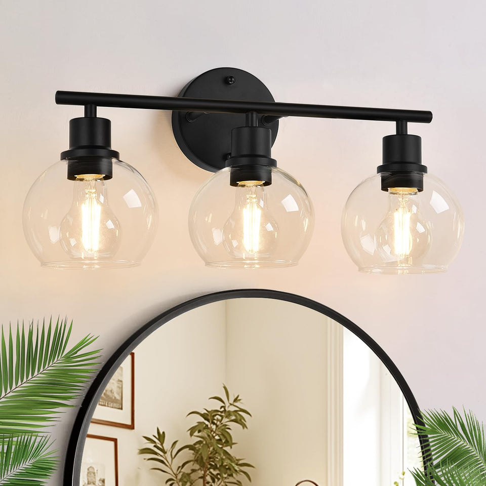 Indoi 3-light matte black fixture over mirror for bright vanity tasks.