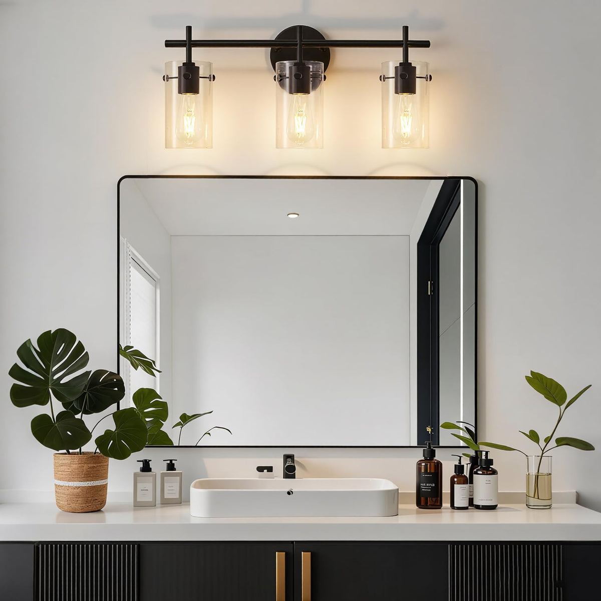 Indoi glass shades above mirror illuminate the vanity area evenly.