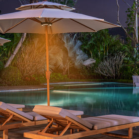 INKEER outdoor lighting for patio, camping, or card games at dusk.