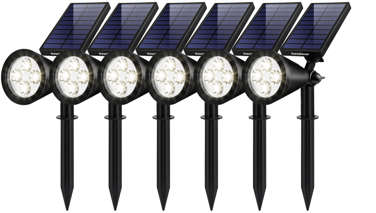 InnoGear solar light with adjustable panel stake illuminates pathways at dusk.