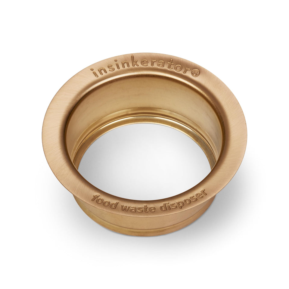 InSinkErator FLG-BB brushed bronze flange close-up enhances kitchen aesthetics.
