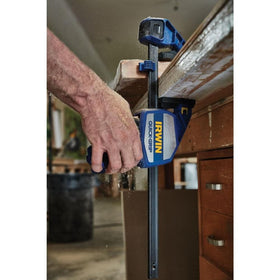 IRWIN Quick-Grip 12inch bar clamp in spreader mode with Quick-Change button.