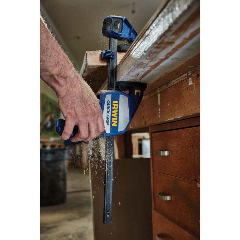 IRWIN Quick-Grip 12inch bar clamp upright on a work surface with adjustable foot.