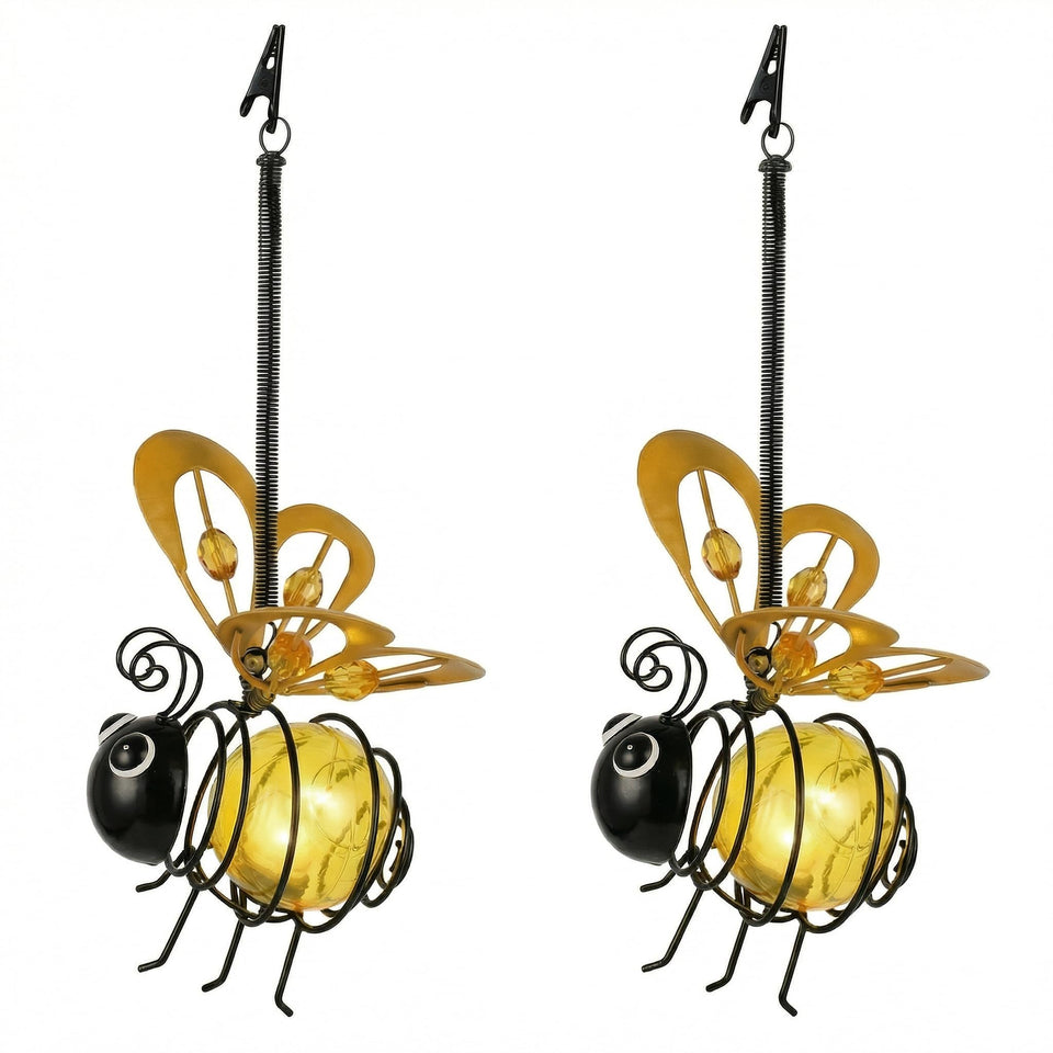 iStatue hanging solar bee lights add warm ambient glow to outdoor gardens.