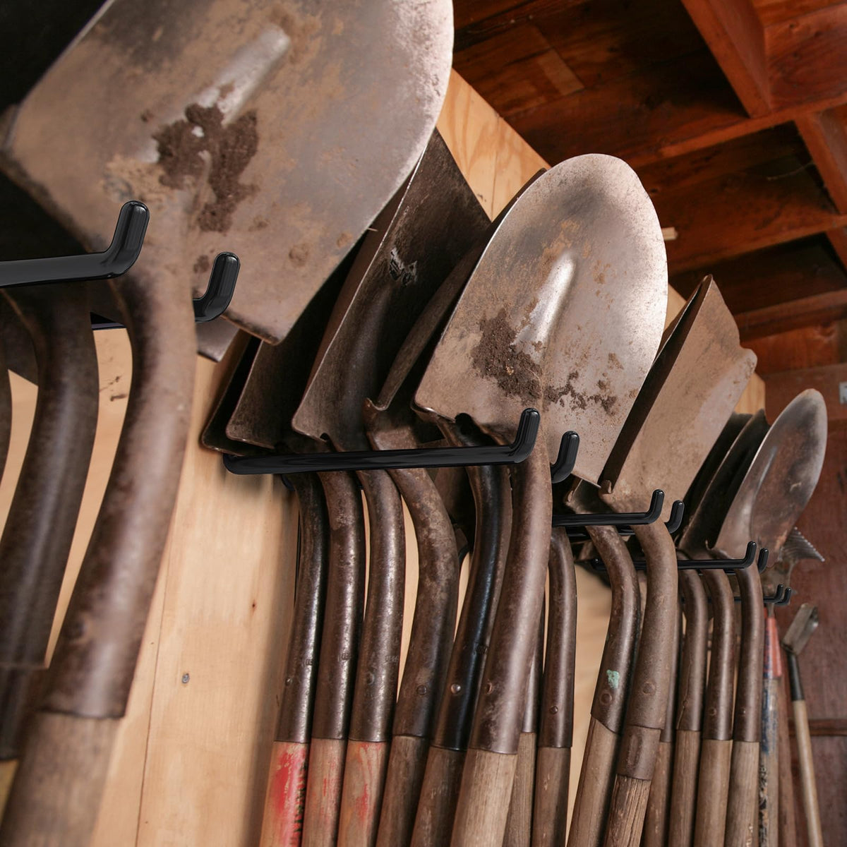 ITCPRIM organized garage scene with tools and hoses neatly hung.