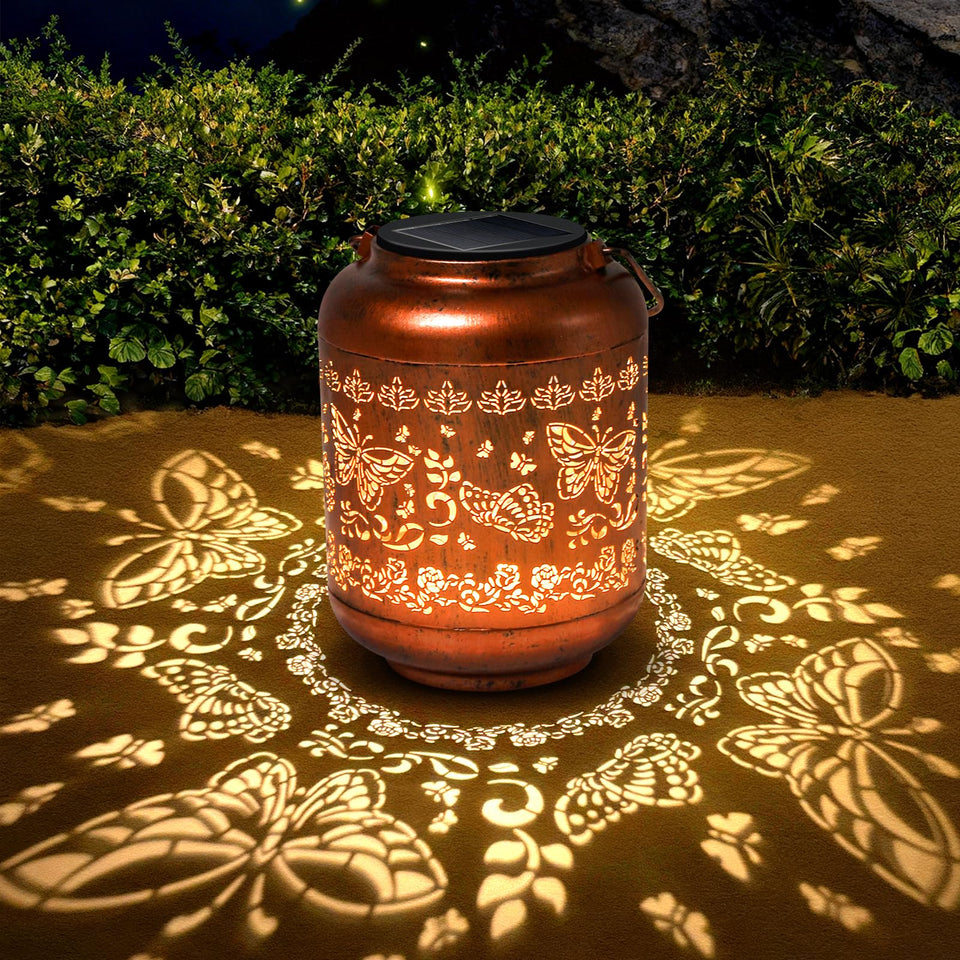 IYEZIGI butterfly solar lantern with copper finish brightens garden spaces at night.