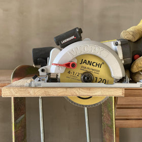 Janchi blade cutting vinyl siding for fast, smooth cross-cuts.