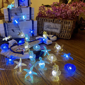 JASHIKA coastal solar string lights Garden-decor: durable waterproof yard accent.