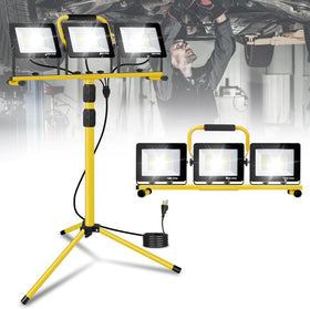 JDZKOMKE 21000LM LED work light on a stand providing ultra-bright illumination for job sites