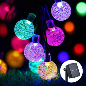Jedavai Solar String Lights illuminate gardens with 100 LED multi-color crystal globes for festive ambiance.