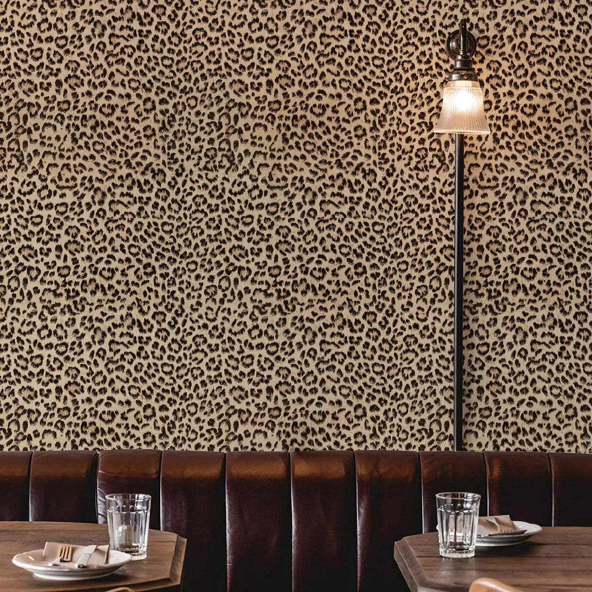 Leopard wallpaper enhances room ambiance with vibrant, energetic decor.