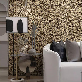 JiffDiff leopard wallpaper applied to bedroom wall for stylish transformation.