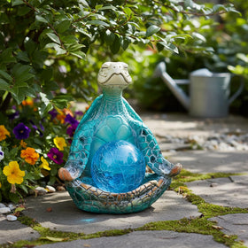JJALIGHTS sea-turtle blue gazing ball glows softly after dark for ambiance.