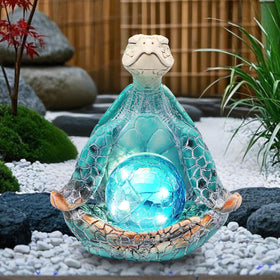 The yoga pose turtle statue by JJALIGHTS brings zen to your patio.