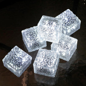 JKIMK Solar Brick Light on patio with warm ambient glow for evenings.