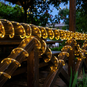 Jnaurb solar rope lights on a patio create warm, inviting outdoor dining ambiance