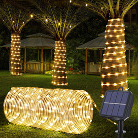 Jnaurb solar rope lights wrapped around a tree for ambient garden lighting