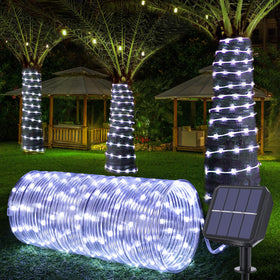Jnaurb solar rope lights wrapped around a tree providing warm outdoor ambiance
