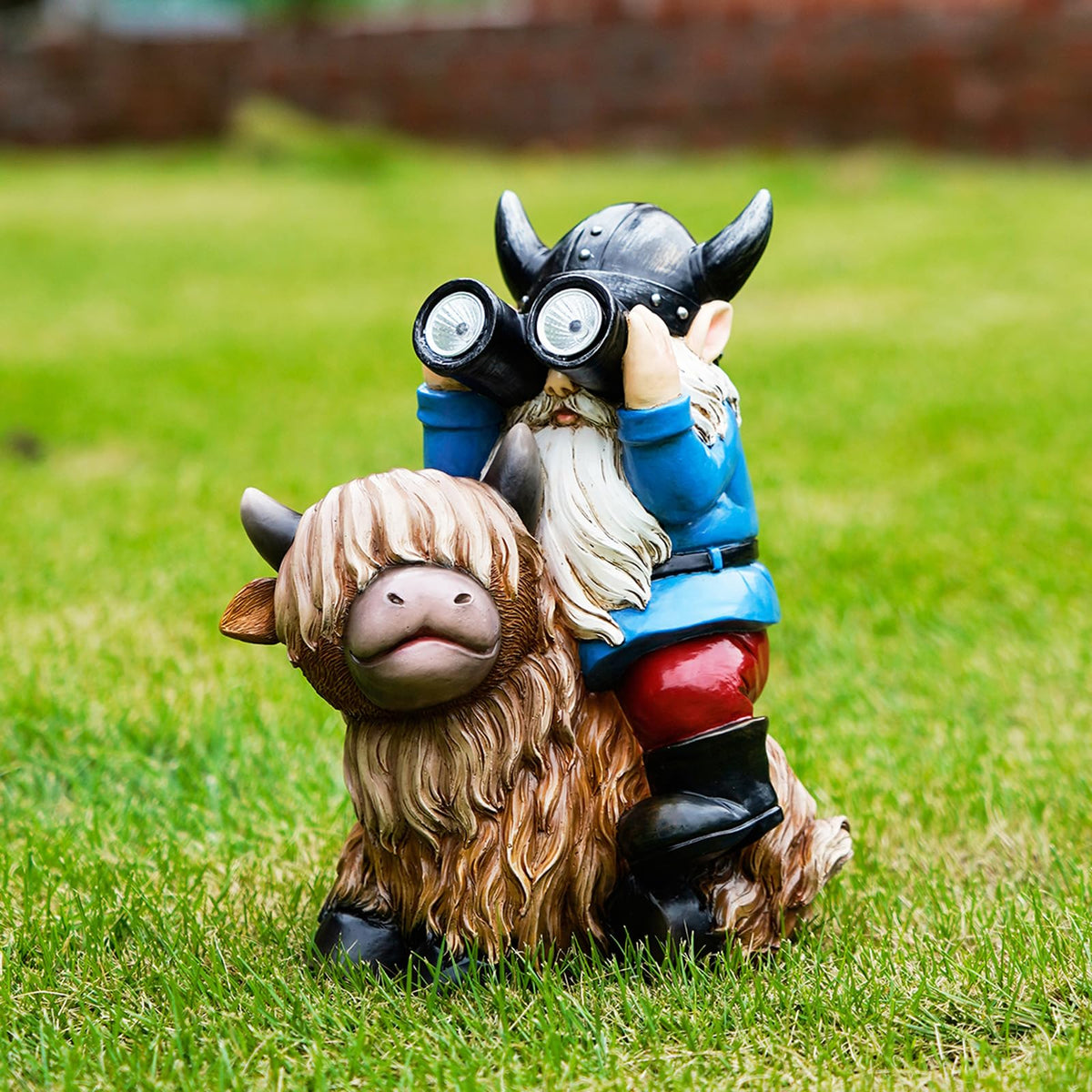 Joint Honglin garden gnome on Highland cow enhances nighttime yard charm.