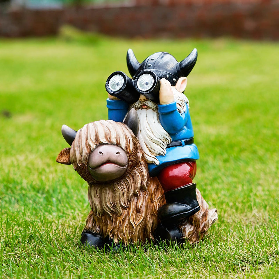 Joint Honglin garden gnome on Highland cow enhances nighttime yard charm.