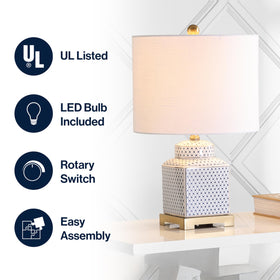 Brass riser detail on the JONATHAN Y lamp enhances height and presence.