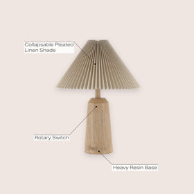 JONATHAN Y lamp with black pleated shade enhances a living space.