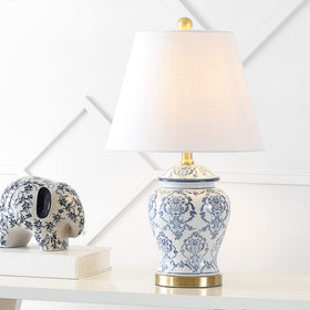 The JONATHAN Y blue-white chinoiserie urn lamp shade adds soft ambient light.